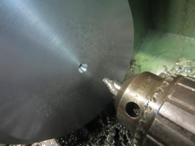 Centre drilling steel in lathe